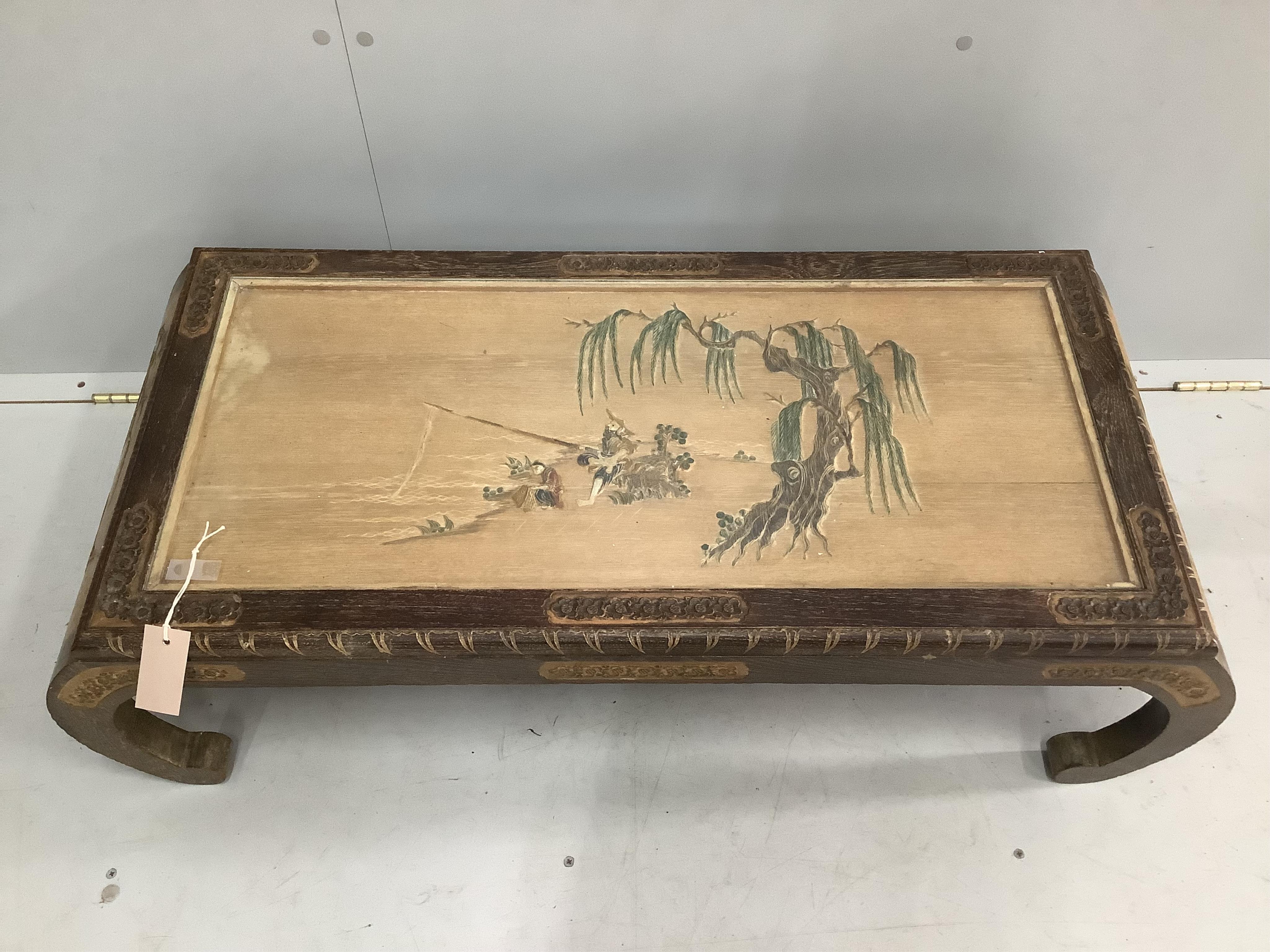 A Malaysian carved hardwood low table, width 102cm, depth 45cm, height 30cm and a standard lamp. Condition - fair